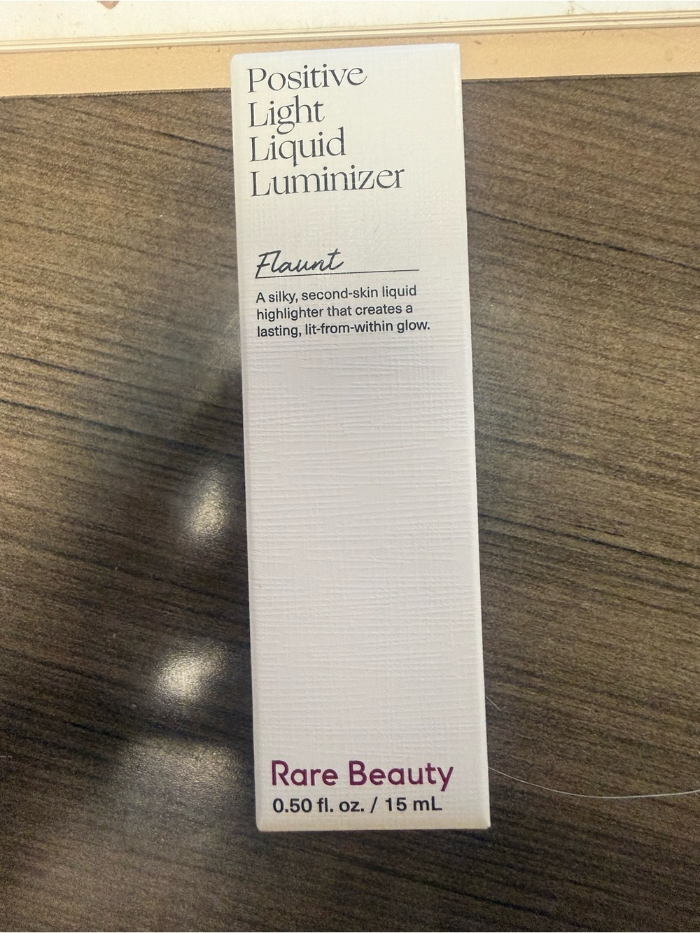 NWT Rare Beauty Positive Light Liquid Luminizer - Flaunt (White, Purple Text)
